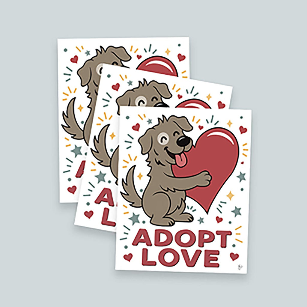 Set of three Adopt Love prints stacked in a playful arrangements on light background, Adopt Love art print with smiling brown dog with white patch around right eye hugging a red heart surrounded by yellow diamonds, teal stars, red hearts, teal dots, and teal & yellow lines on a white background