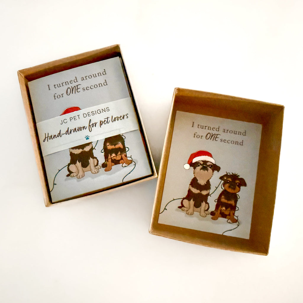 Two decorative boxes of hand-drawn custom set of greeting cards with illustrations of dogs and text on a white background