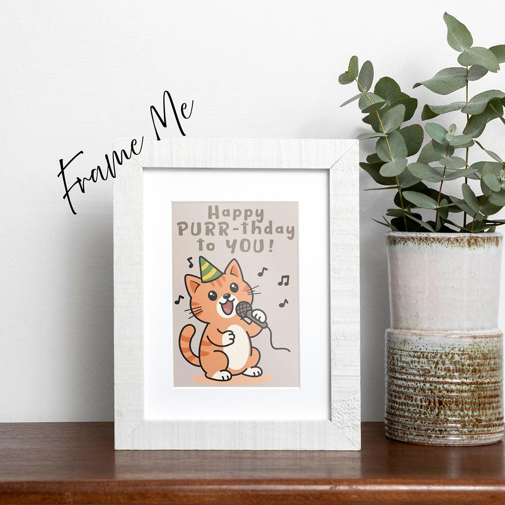 framed Happy Purr-thday birthday card featuring an orange cat with tan belly standing up with microphone in left paw and green & yellow party hat on and musical notes floating around cat, text on top of card reads "Happy Purr-thday to You", the card has a muted light brown background, frame not included in purchase