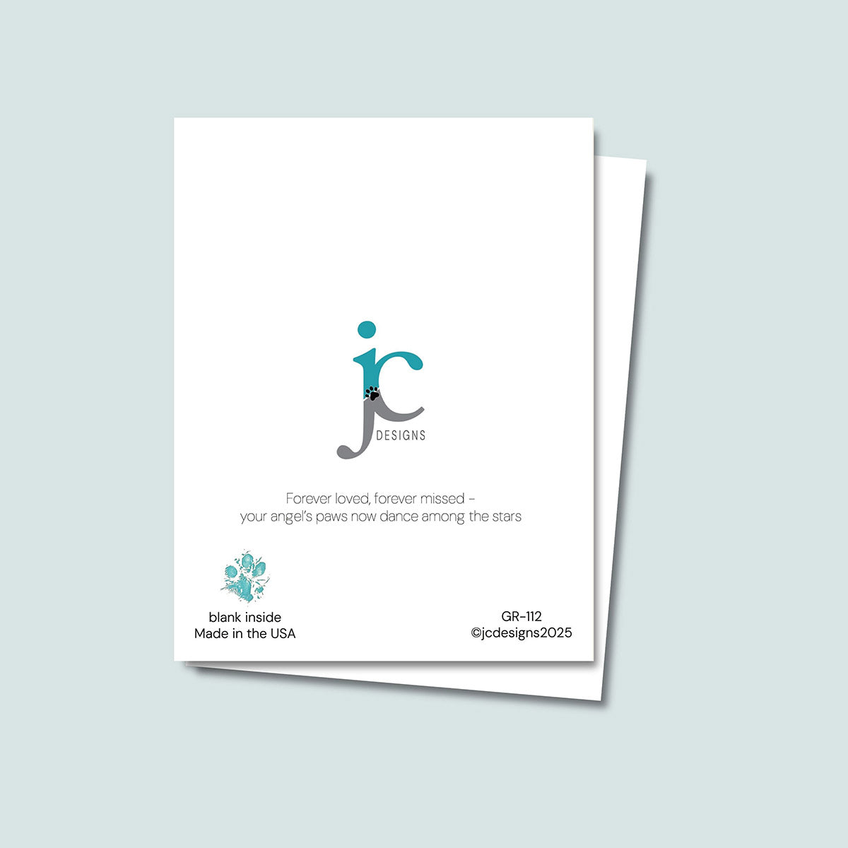 back of Heaven Gained a Paw-Angel card showing JC Pet Designs logo and unique tagline that reads "Forever loved, forever missed - your angel's paws now dance among the star", in the bottom left corner is Oz's paw print in teal and text "blank inside, Made in the USA", the sku and copyright @jcpetdesigns 2025 in the bottom right corner