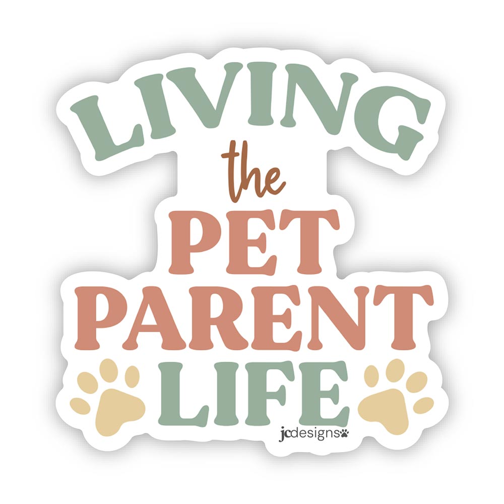 living the pet parent life sticker with modern typography and paw print accents in earthy pastel colors perfect for cat dad, dog mom