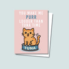 Tuna Time card featuring a cute orange cat sitting on a can of tuna, text on top of card reads "You Make Me Purr Louder than Tuna Time", the card has a muted pink background