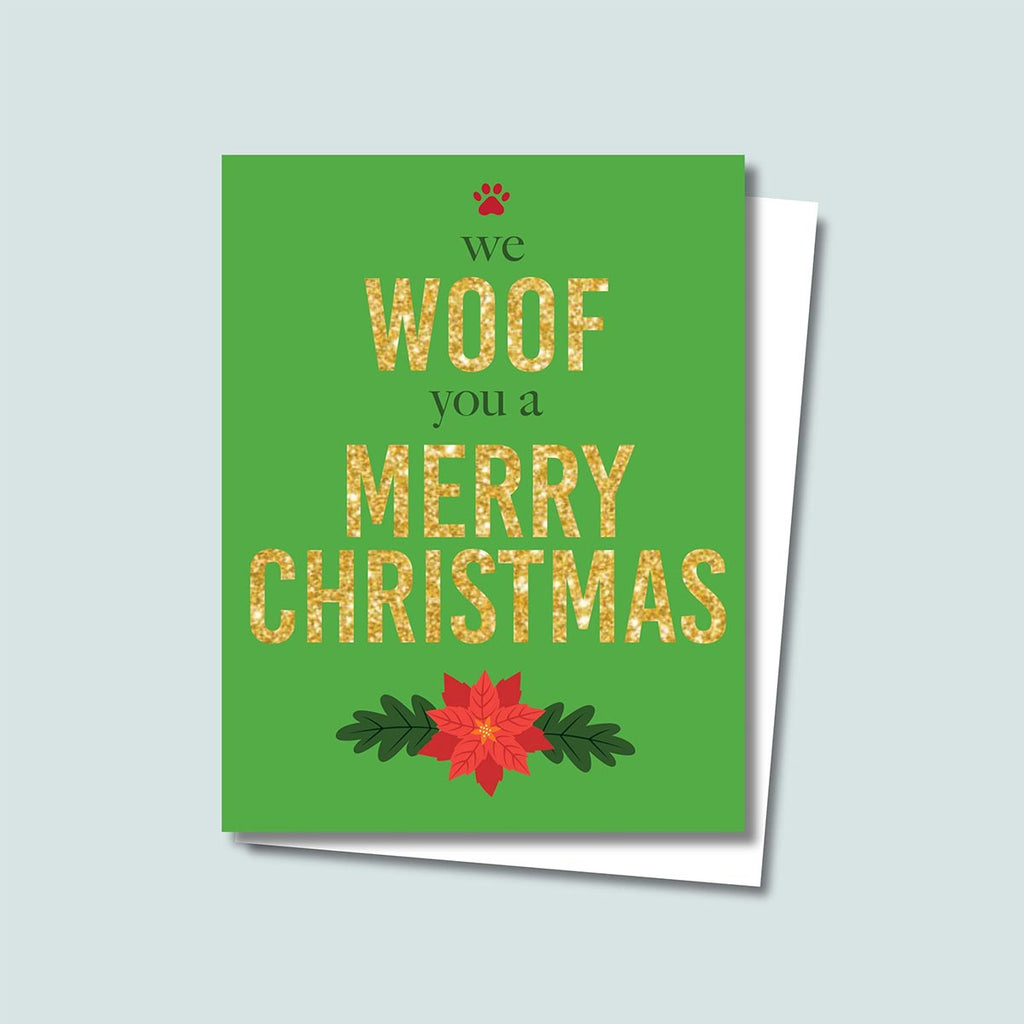 We Woof You a Merry Christmas holiday card featuring Woof and Merry Christmas in gold-glitter-style text, we and you a are in a dark green text, a red paw print is on top of the card and a red poinsettia is on the bottom of the card, the background is green