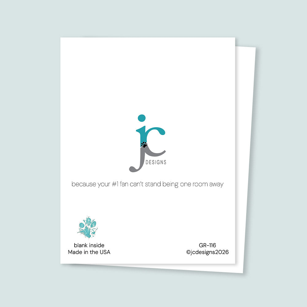 Back of greeting card showing the JC Designs logo with the phrase “because your #1 fan can’t stand being one room away,” noting the card is blank inside and made in the USA