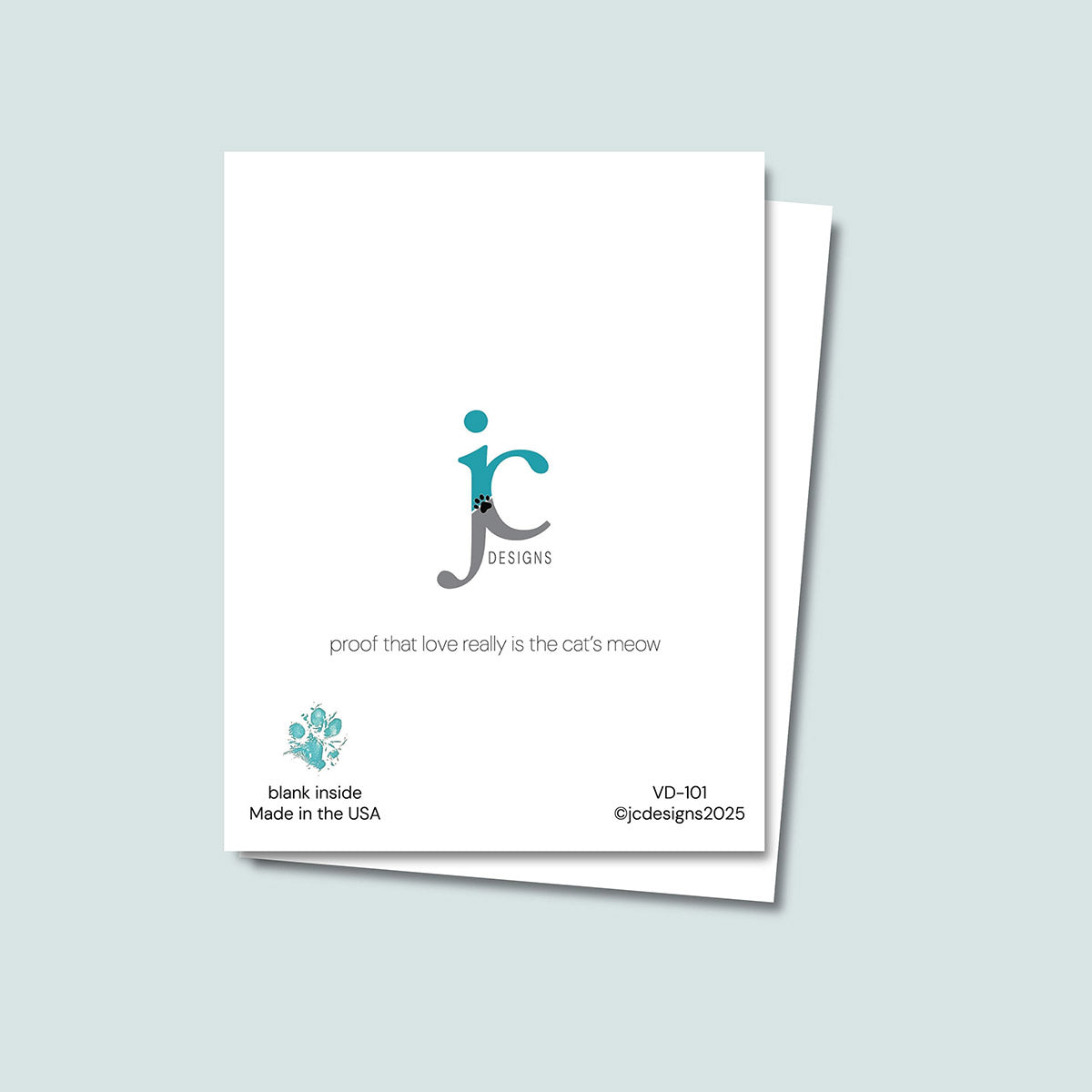 back of Feline Fine Valentine's Day card showing JC Pet Designs logo and unique tagline that reads "proof that love really is the cat's meow", in the lower left corner is Oz's paw print in teal and text that reads "blank inside, made in the USA", the sku and copyright @jcpetdesigns2025 are on the lower right corner