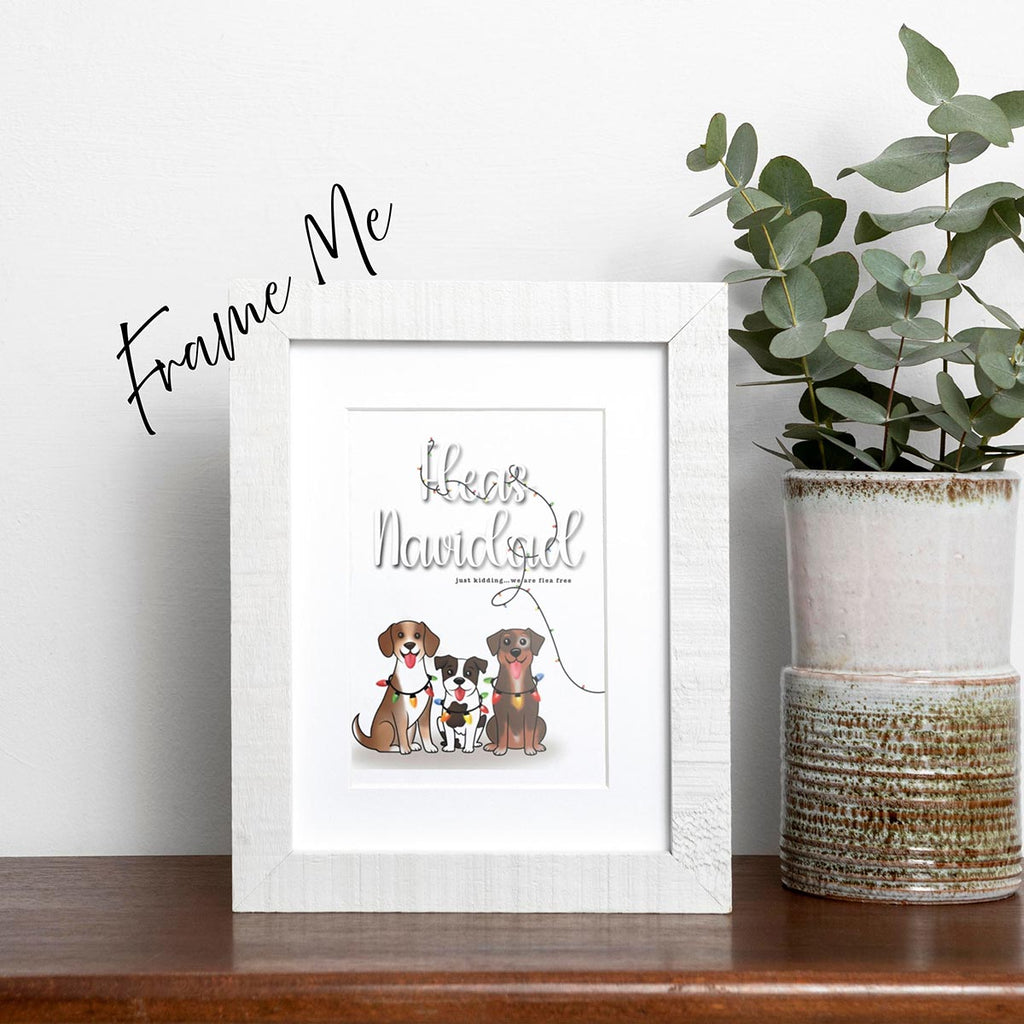 framed Fleas Navidad Christmas card featuring three cute dogs wrapped in colorful holiday lights with the funny phase "Fleas Navidad, just kidding...we are flea free", colorful holiday lights wrapped through the texts from top of card to lower right side, card has a white background
