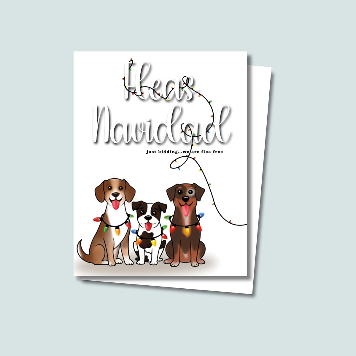 Fleas Navidad Christmas card featuring three cute dogs wrapped in colorful holiday lights with the funny phase "Fleas Navidad, just kidding...we are flea free", colorful holiday lights wrapped through the texts from top of card to lower right side, card has a white background
