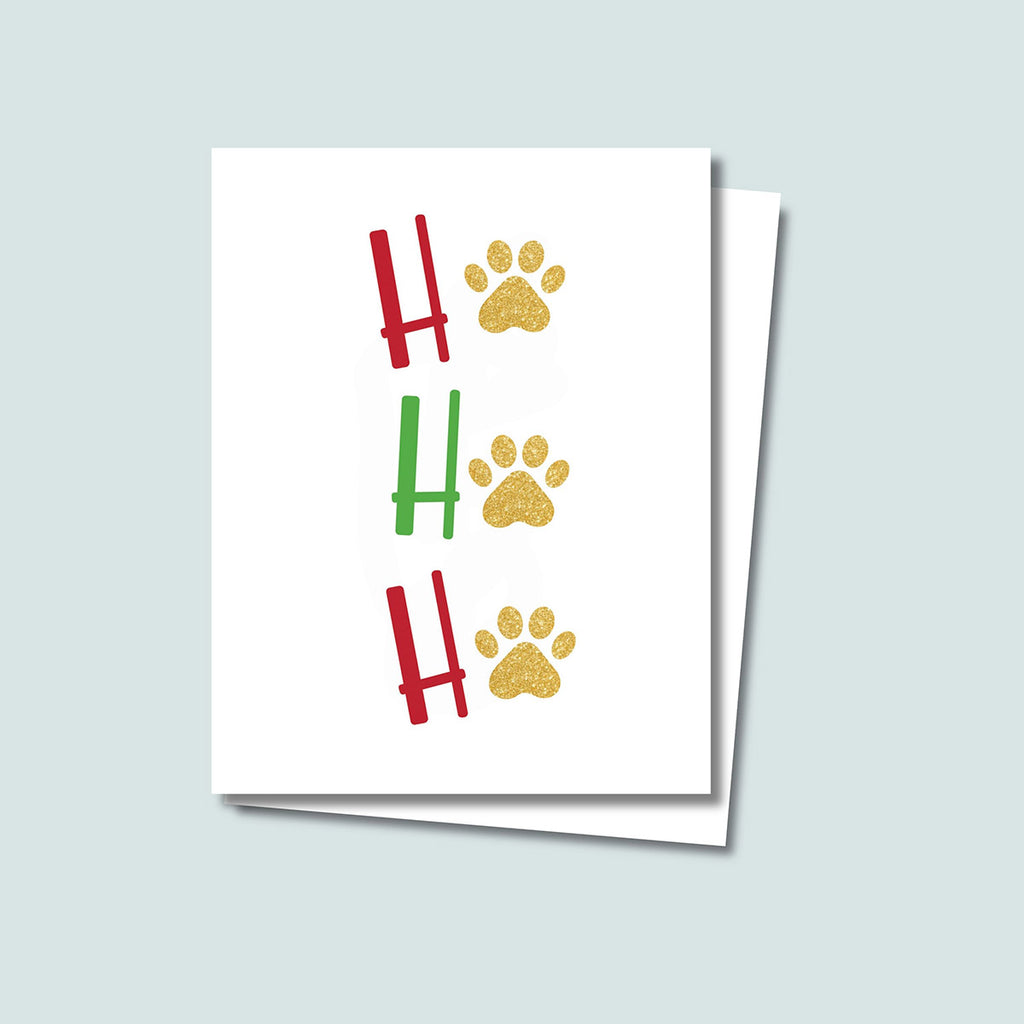 Ho Ho Ho Christmas Holiday card featuring red and green letters with gold paw prints in place of the "O" of all 3 Ho Ho Ho's, on a white background