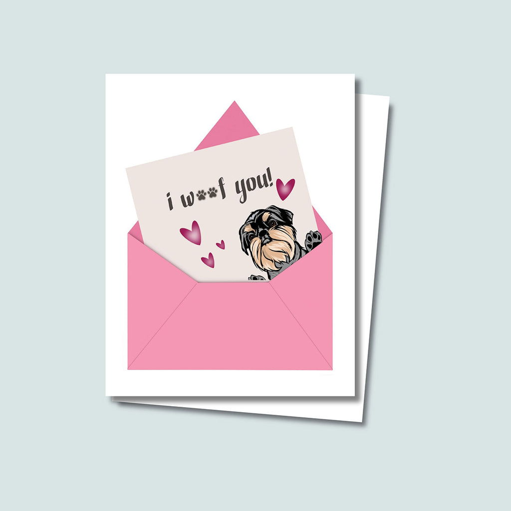 I Woof You greeting card featuring a cute Brussels Griffon peaking out of right side of pink envelope with note saying "i woof you" sticking out of envelope, pink hearts around the dog, card has a white background