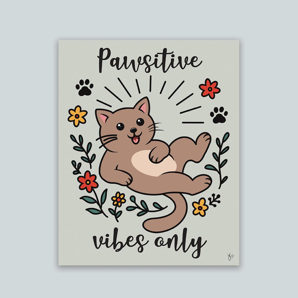 Pawsitive Vibes Only art print featuring happy cartoon brown cat surrounded in a circle of red and yellow flowers and black paw prints with words Pawsitive on top and vibes on bottom print is on a light muted green background