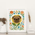 framed Pug flower art print featuring a brown pug's face framed by a yellow flower and surrounded by colorful orange yellow and teal blooms with green leaves and stems on a white background, frame not included in purchase
