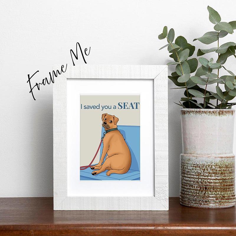 framed greeting card with illustration of a tan dog sitting on a blue bench with a leash and the words “I saved you a seat.”